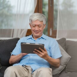 Older gentleman on a tablet